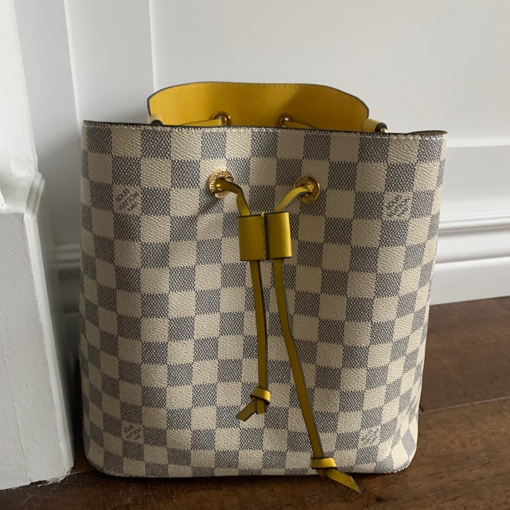 Louis Vuitton grey and white bag.